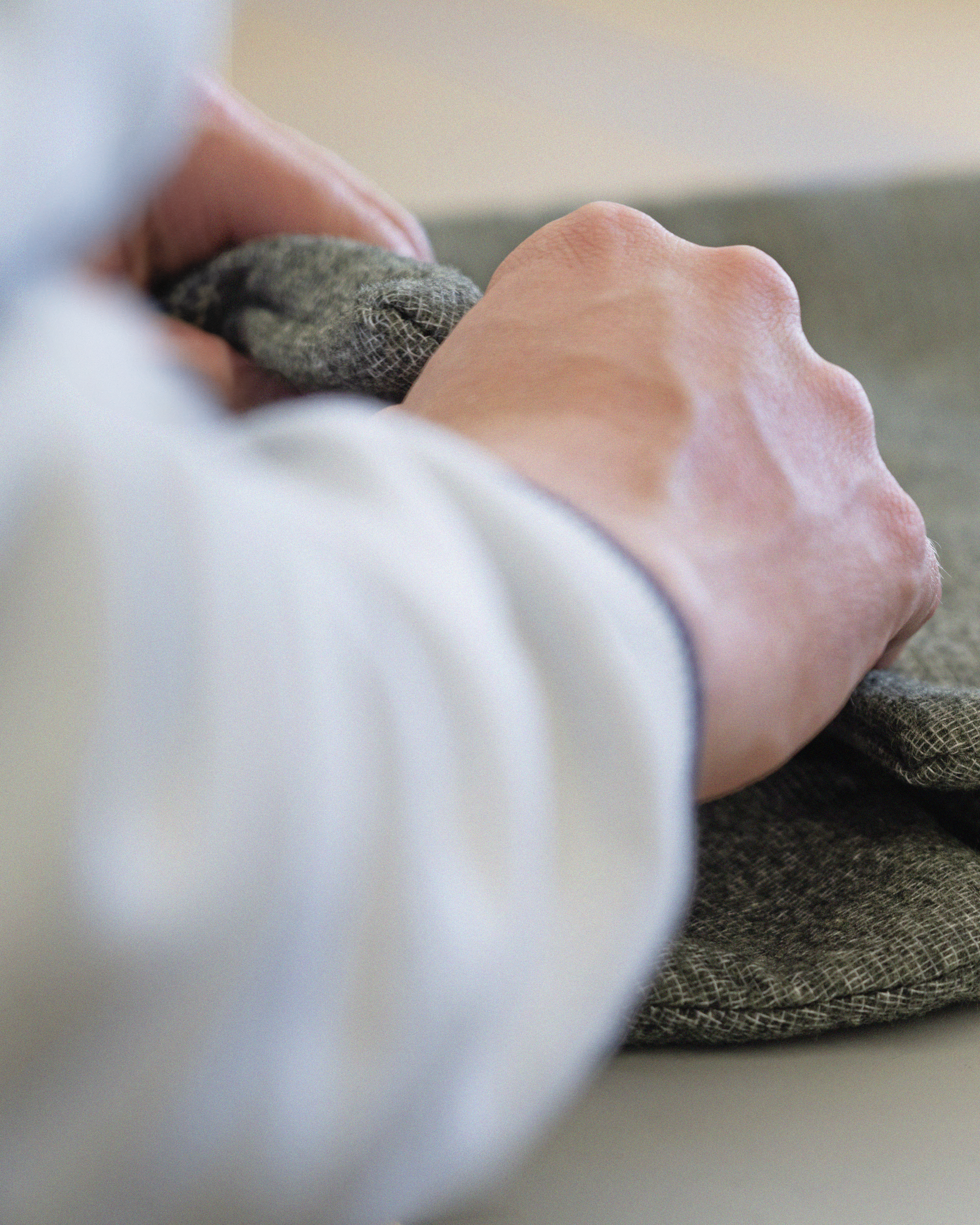 Hands checking quality of heater mat